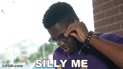 Man In Sunglasses And Purple Shirt Talking On Phone Saying Silly Me GIF