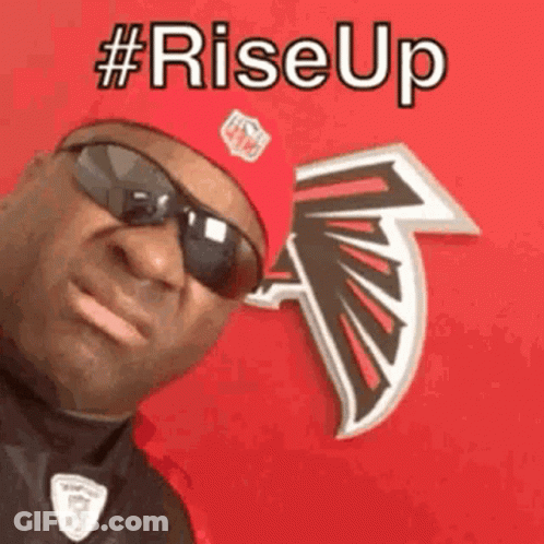 Man In Sunglasses And Red Hat In Front Of NFL Logo GIF