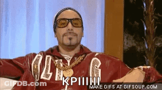 Man In Sunglasses And Red Jacket Sitting On Couch Making Funny Face GIF