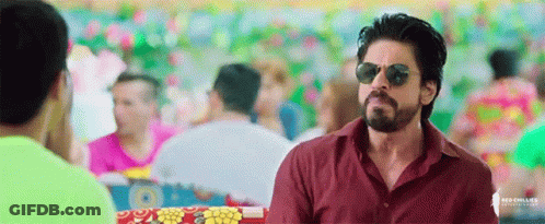 Man In Sunglasses And Red Shirt In Front Of Crowd GIF