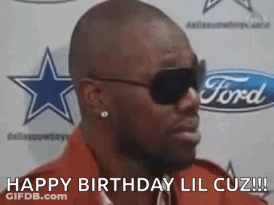 Man In Sunglasses And Red Shirt In Front Of Ford Logo GIF