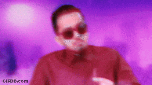 Man In Sunglasses And Red Shirt On Purple Background GIF