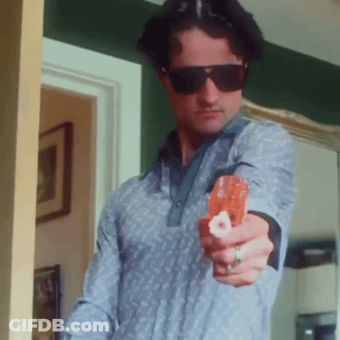 Man In Sunglasses And Ring Pointing Gun At Camera GIF