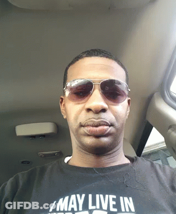 Man In Sunglasses And Shirt Saying May Live In GIF