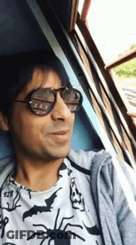 Man In Sunglasses And Spider Shirt Sitting In Car GIF