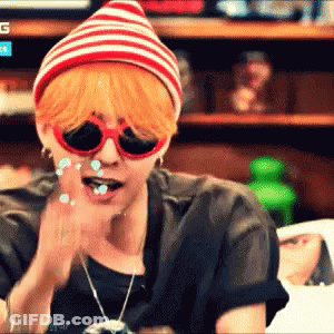 Man In Sunglasses And Striped Hat Applauding GIF