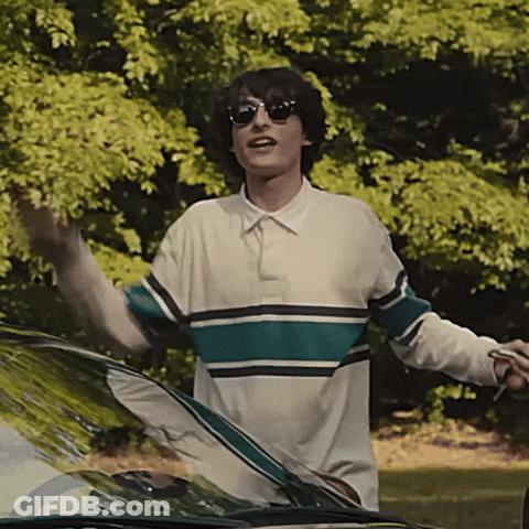 Man In Sunglasses And Striped Shirt By Car GIF