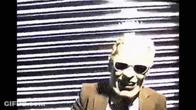 Man In Sunglasses And Suit At Black White Striped Wall GIF