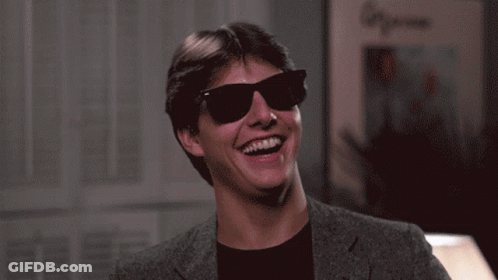 Man In Sunglasses And Suit Laughing GIF