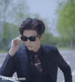 Man In Sunglasses And Suit Next To Car GIF