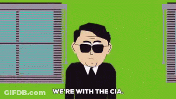 Man In Sunglasses And Suit Says We're With The CIA GIF