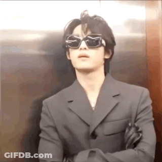 Man In Sunglasses And Suit Standing In Elevator GIF