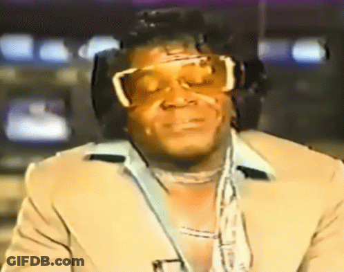 Man In Sunglasses And Suit Watching TV GIF