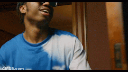 Man In Sunglasses And Tie Dye Shirt GIF