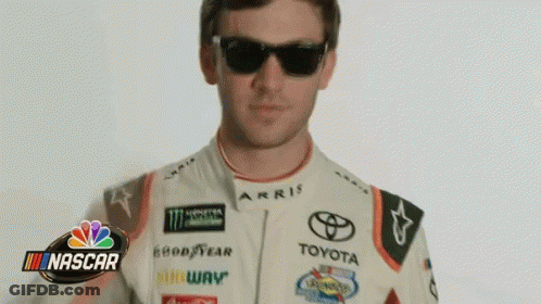 Man In Sunglasses And Toyota Racing Suit In Front Of NASCAR Logo GIF