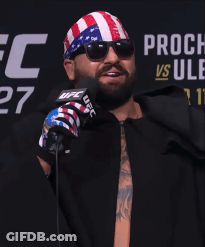 Man In Sunglasses And UFC Bandana In Front Of Microphone GIF