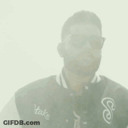 Man In Sunglasses And Varsity Jacket Touching Forehead GIF