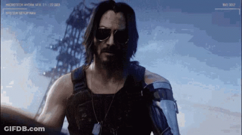 Man In Sunglasses And Vest In Front Of Microtech Hydra Screen GIF