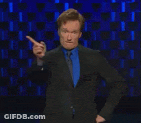 Man In Sunglasses And Watch Sitting On Bed GIF