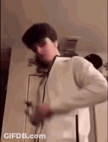Man In Sunglasses And White Jacket Standing By Door GIF
