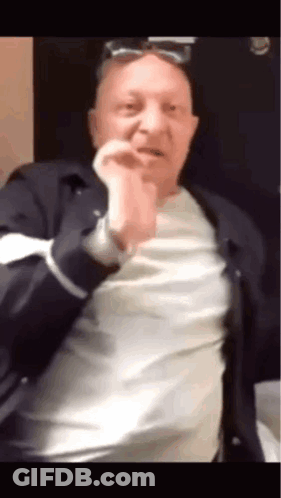 Man In Sunglasses And White Shirt Making Funny Face GIF
