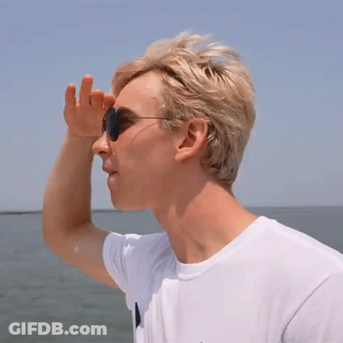 Man In Sunglasses And White Shirt Over Water GIF