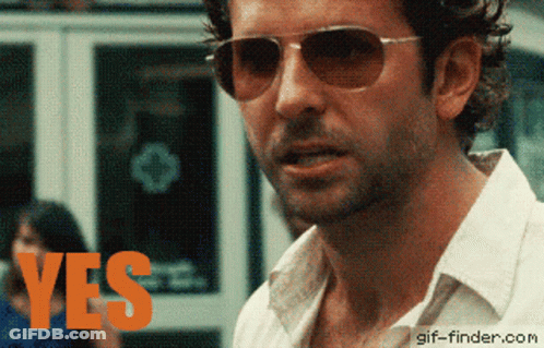 Man In Sunglasses And White Shirt Says Yes GIF