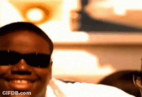 Man In Sunglasses And White Shirt Smiling GIF