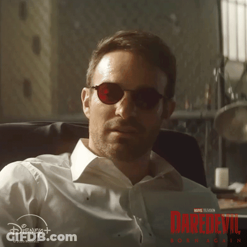 Man In Sunglasses And White Shirt With Daredevil Poster GIF