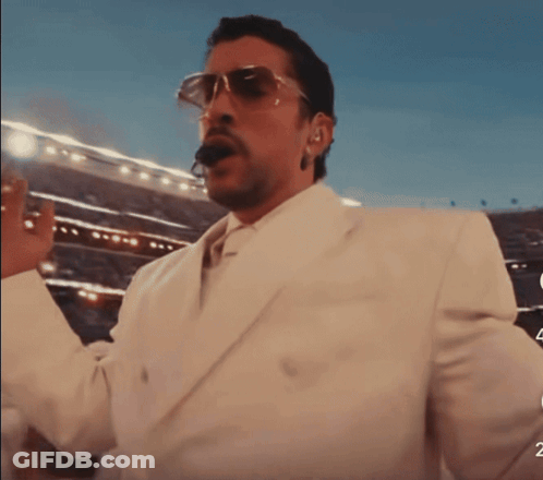 Man In Sunglasses And White Suit Says Levantate Mijo GIF