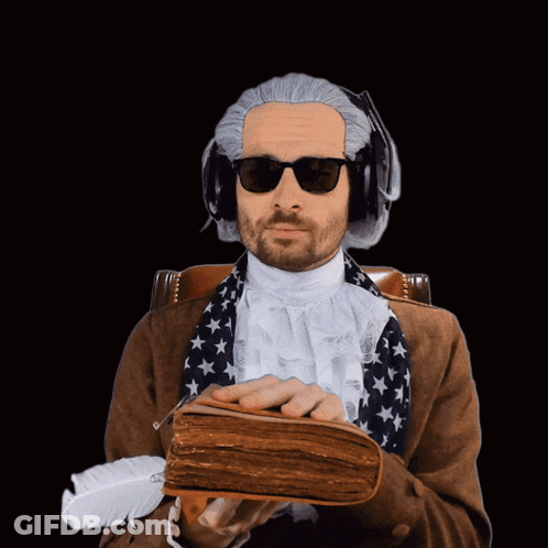 Man In Sunglasses And Wig Holding Book GIF
