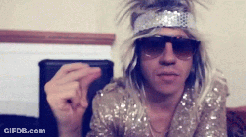 Man In Sunglasses And Wig Making Funny Face GIF