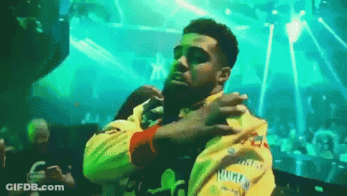 Man In Sunglasses And Yellow Jacket Dancing GIF