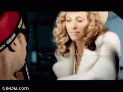 Man In Sunglasses And Yellow Jacket Saying MG GIF