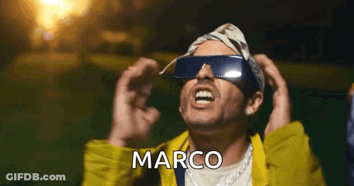 Man In Sunglasses And Yellow Jacket With Marco On Face GIF