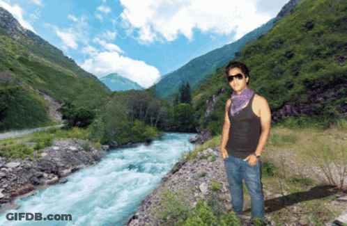 Man In Sunglasses By Mountain River GIF