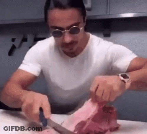 Man In Sunglasses Cutting Meat GIF