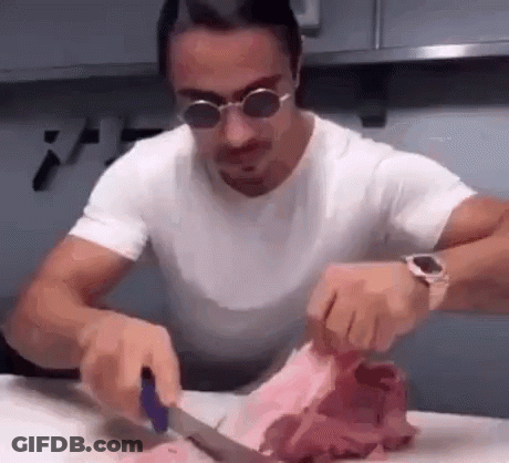 Man In Sunglasses Cutting Meat GIF