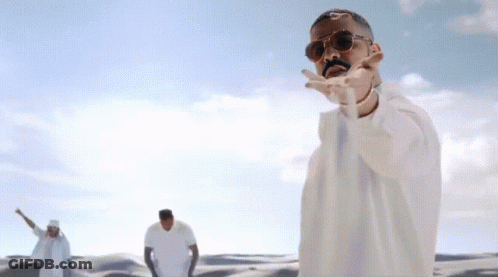 Man In Sunglasses Dancing In Desert GIF