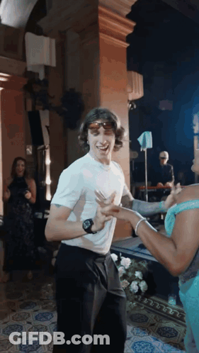 Man In Sunglasses Dancing With Woman GIF