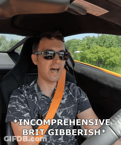 Man In Sunglasses Driving Car Saying Incomplete Brit Gibberish GIF