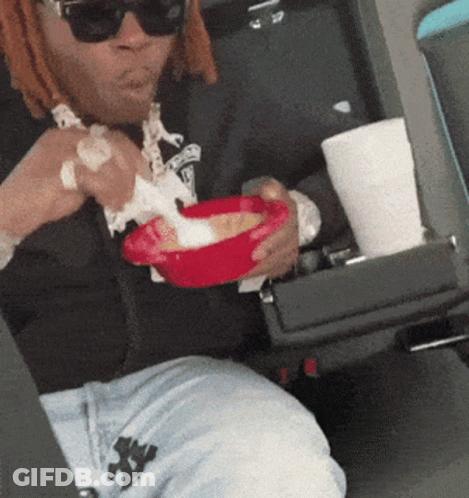 Man In Sunglasses Eating In Car GIF