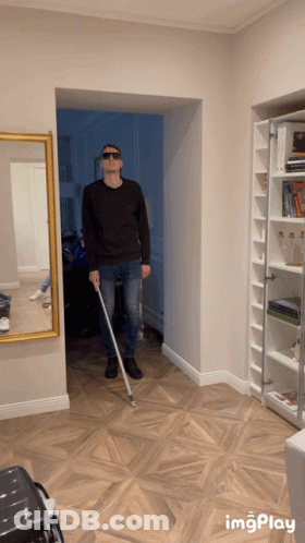 Man In Sunglasses Holding Cane GIF