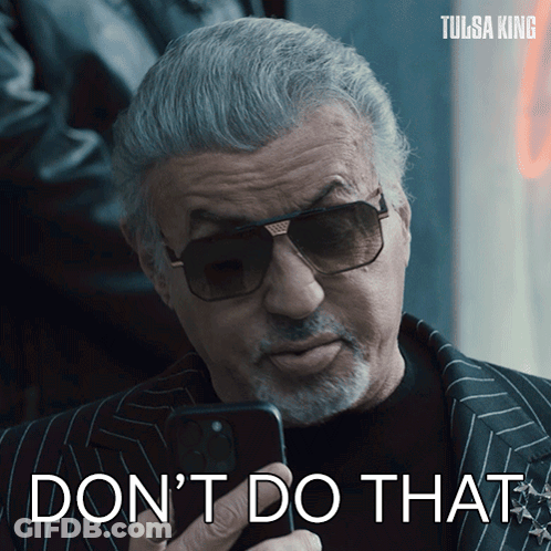 Man In Sunglasses Holding Cell Phone Saying Don't Do That GIF