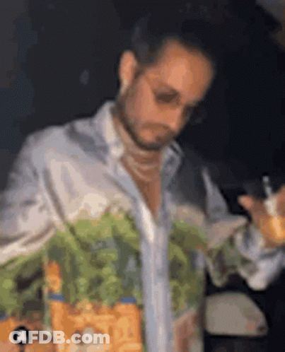 Man In Sunglasses Holding Drink And Cell Phone GIF