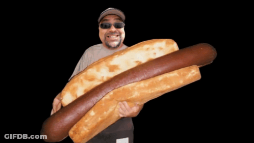 Man In Sunglasses Holding Large Hot Dog GIF
