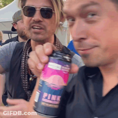 Man In Sunglasses Holding Pink Can GIF