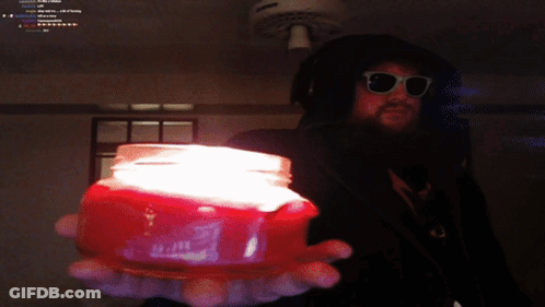 Man In Sunglasses Holding Two Candle Jars GIF