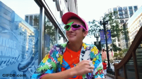 Man In Sunglasses In Front Of Future Forward Building GIF