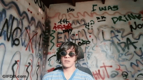 Man In Sunglasses In Front Of Graffiti Saying No I Was Drinking GIF